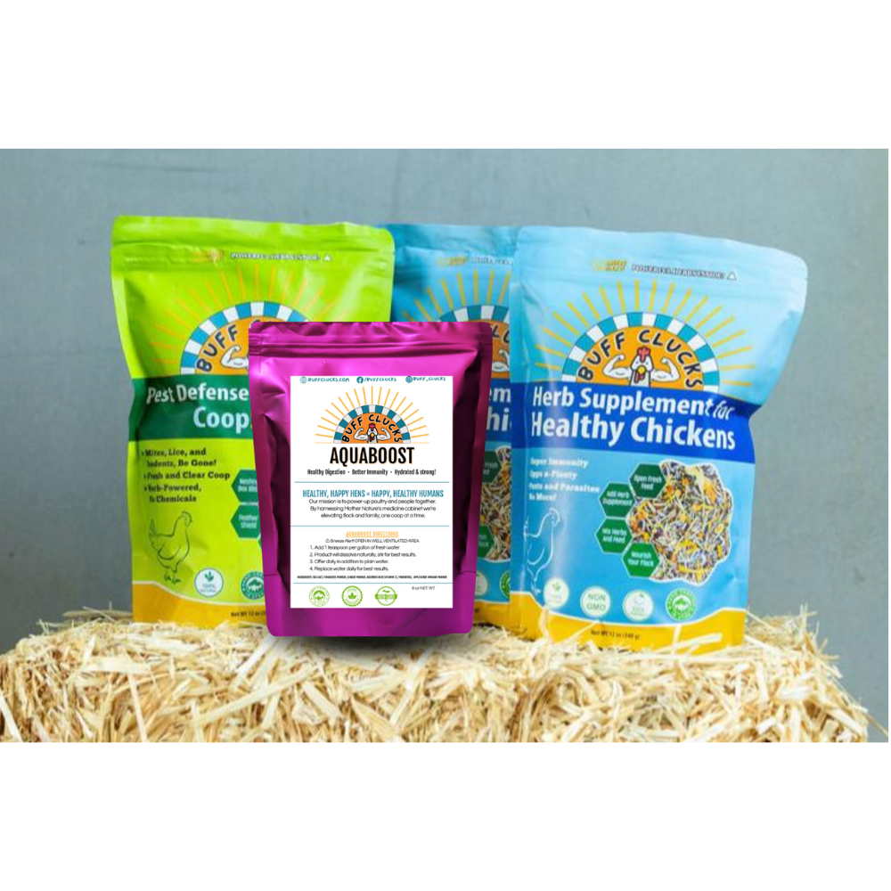 Flock Favorites Bundle with 2 buff clucks herb supplement, 1 coopshield, and 1 aquaboost on a hay bale